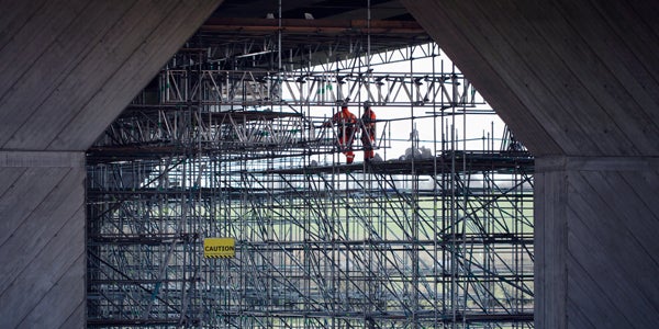 construction workers on scaffolding