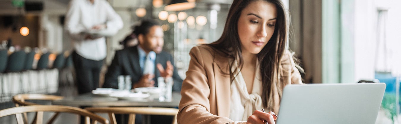 Woman working diligently on her laptop