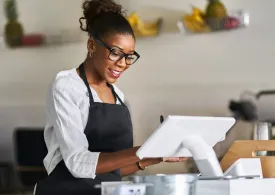 Woman using tablet for a transaction