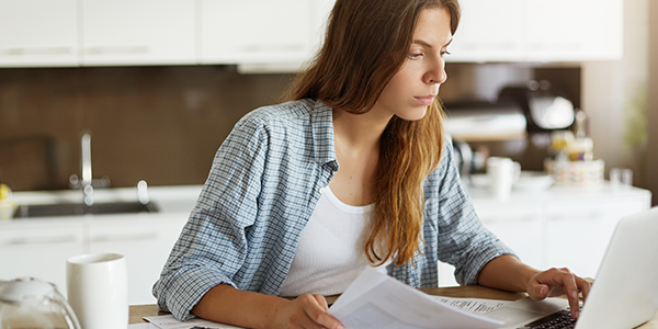 Woman viewing statements on her laptop